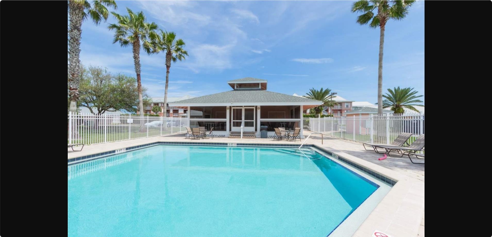210 16th Street St. Augustine Beach, FL 32080 - Photo 14 of 21 a view of swimming pool with outdoor seating and a yard