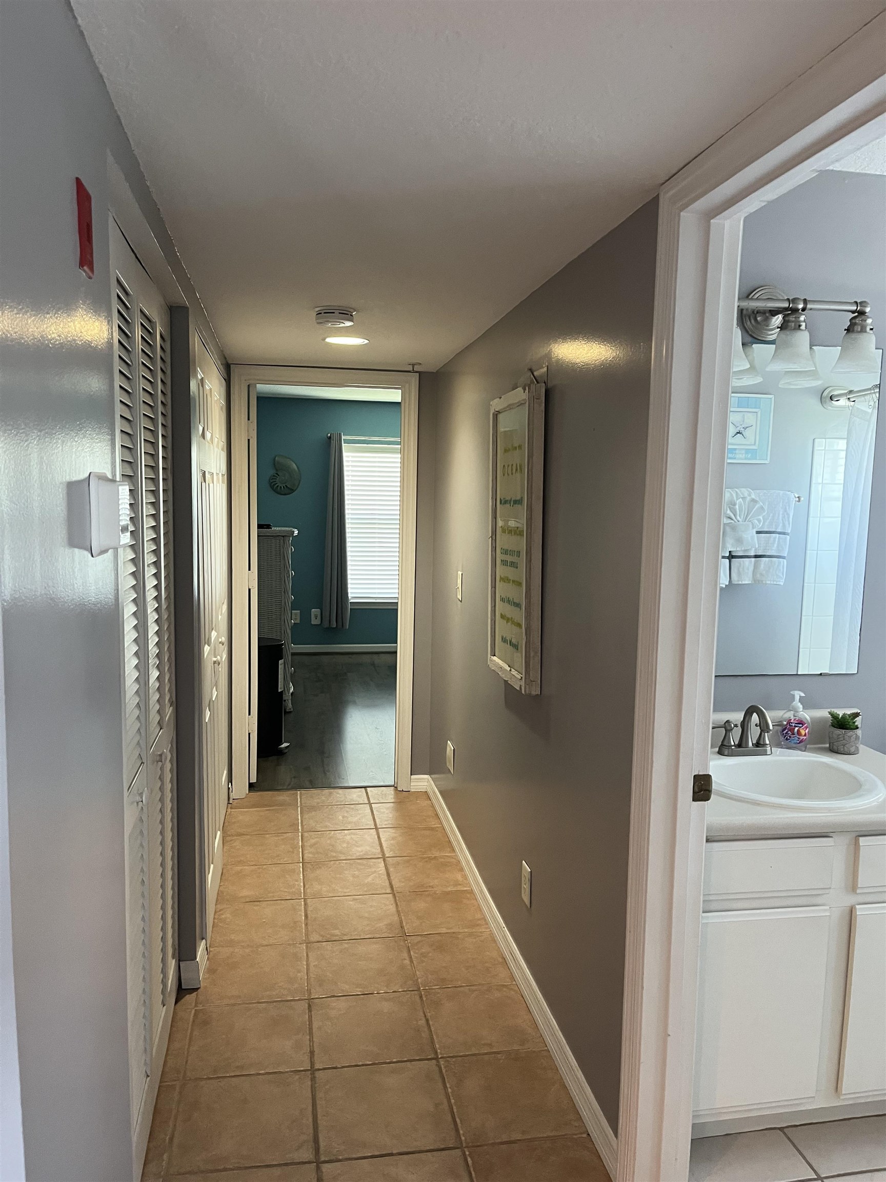 210 16th Street St. Augustine Beach, FL 32080 - Photo 8 of 21 a bathroom with a sink and a mirror