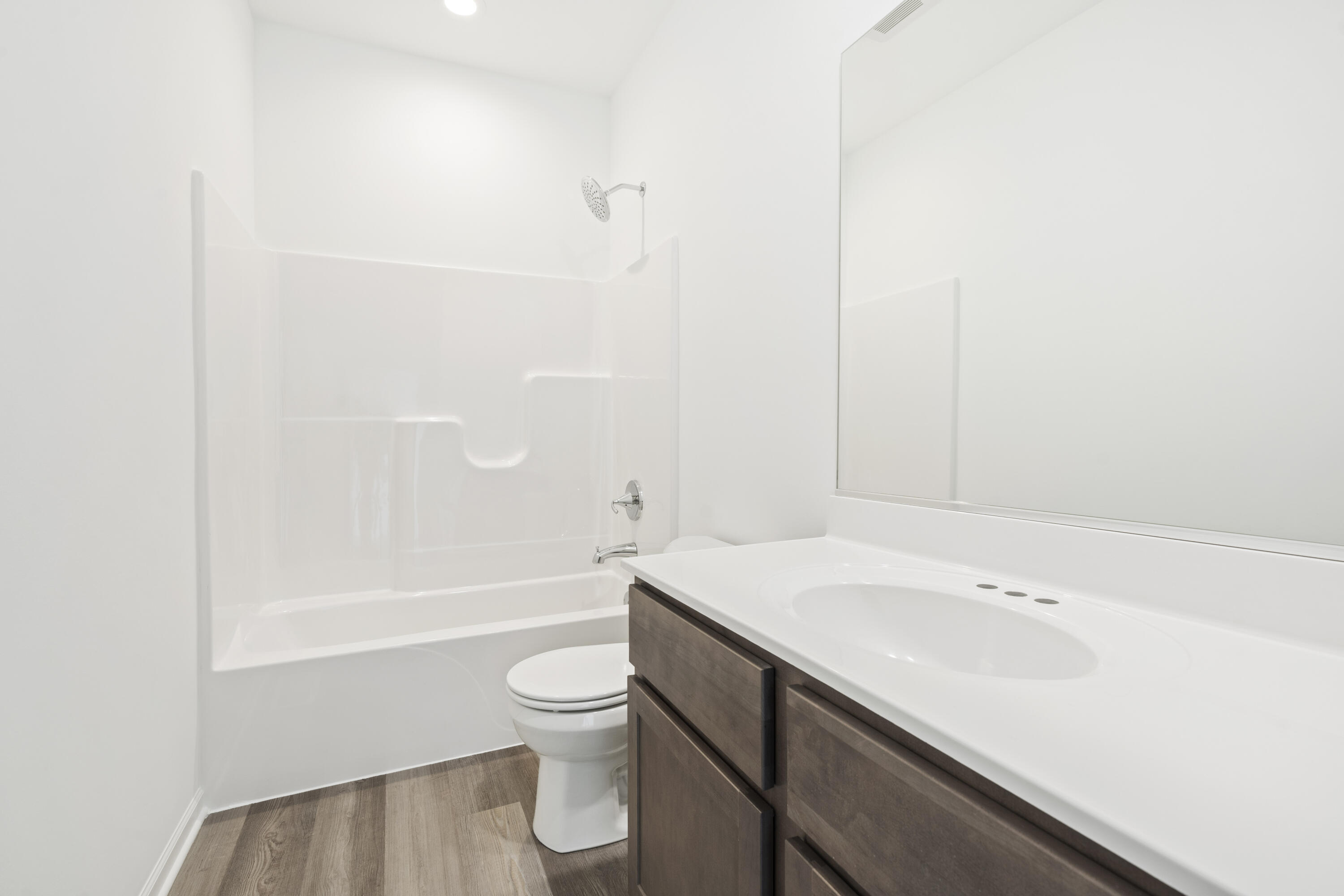 6711 East 103rd Avenue Crown Point, IN 46307 - Photo 5 of 13 a bathroom with a sink a toilet and shower