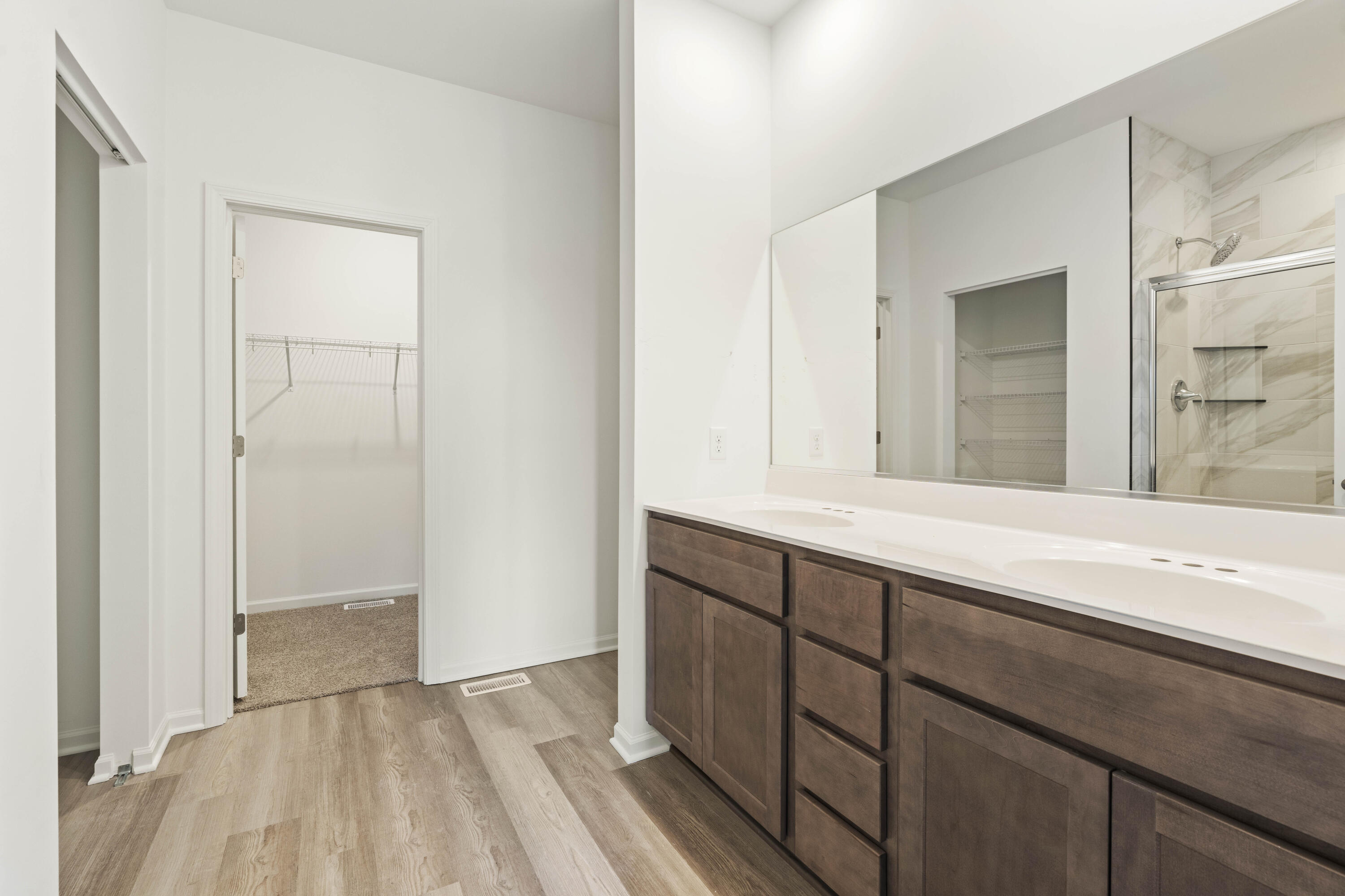6711 East 103rd Avenue Crown Point, IN 46307 - Photo 10 of 13 a bathroom with a sink and a mirror