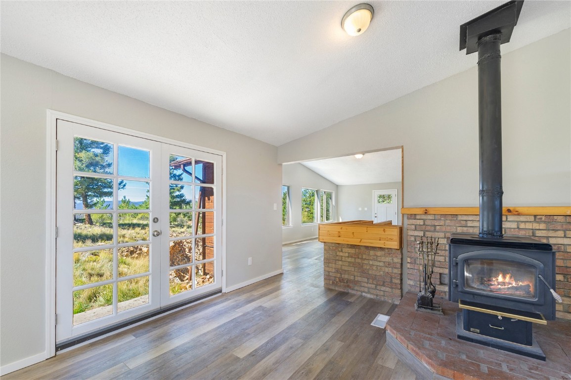 278 Ridge Road Fairplay, CO 80440 - Photo 9 of 50 Dining area facing living room with woodstove