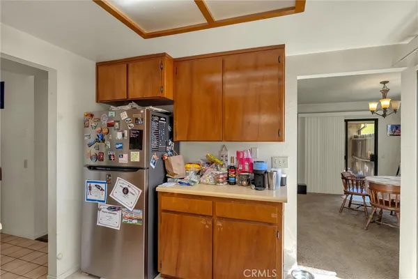 a kitchen with stainless steel appliances a refrigerator and sink