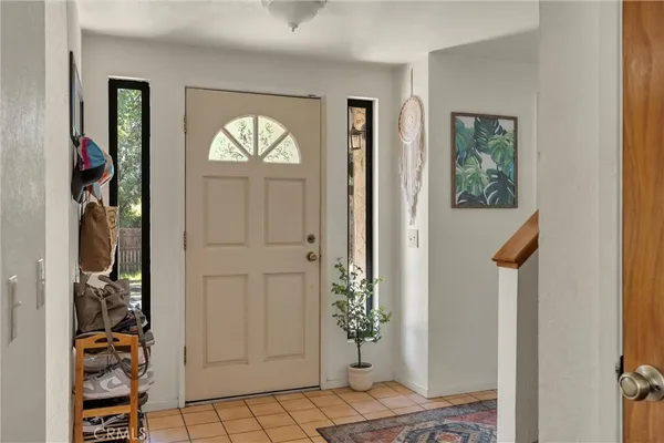 a view of an entryway with wooden floor