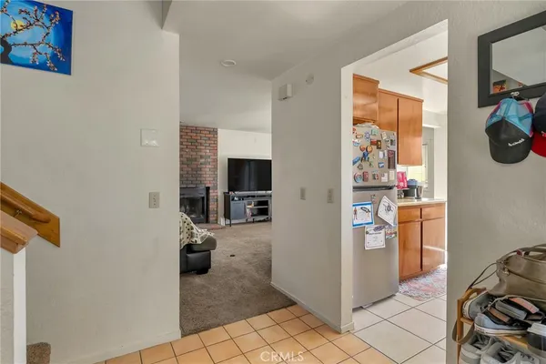 a view of a livingroom with wooden floor and furniture