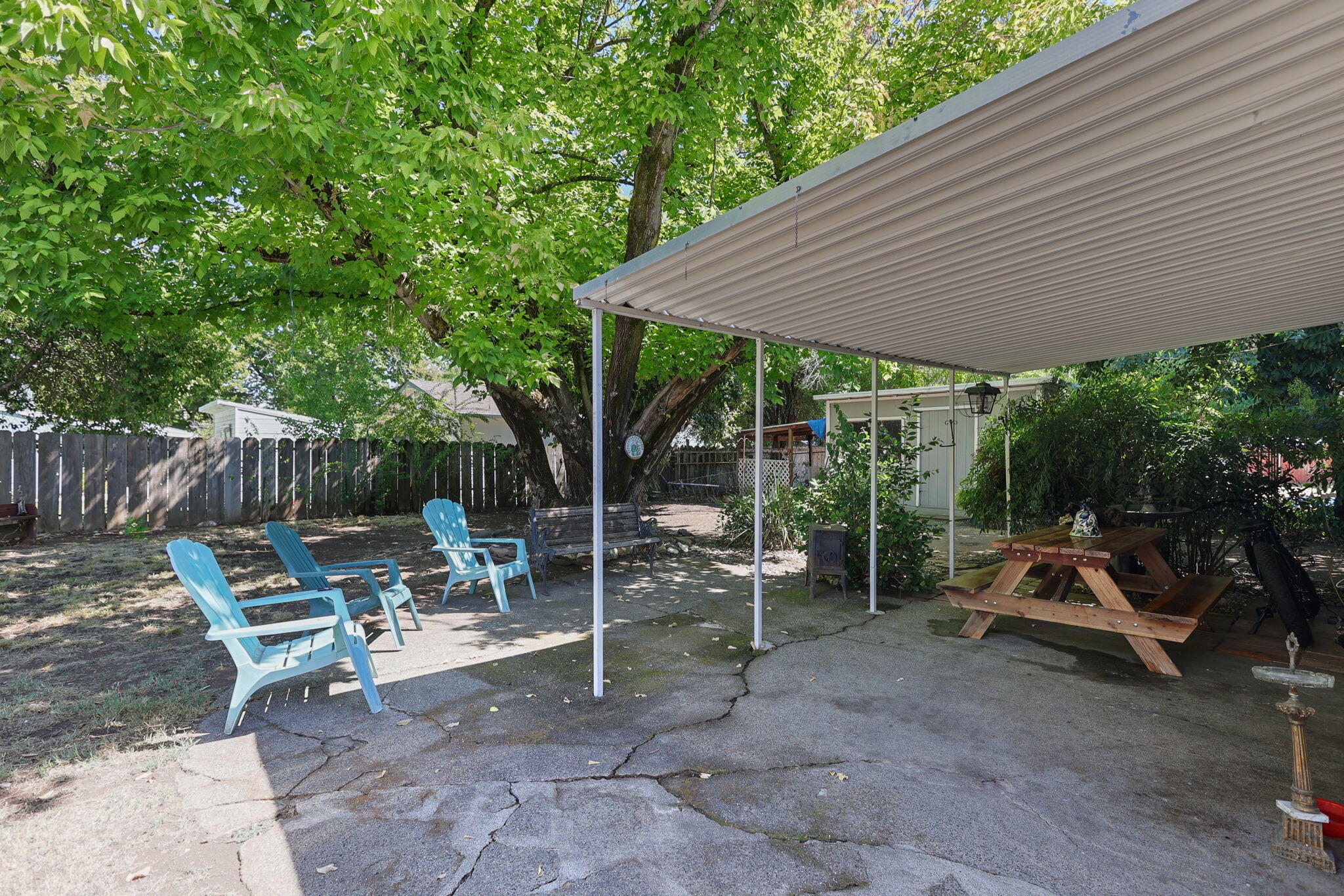 2165 Paris Avenue Redding, CA 96001 - Photo 20 of 22 a view of a patio with table and chairs under an umbrella