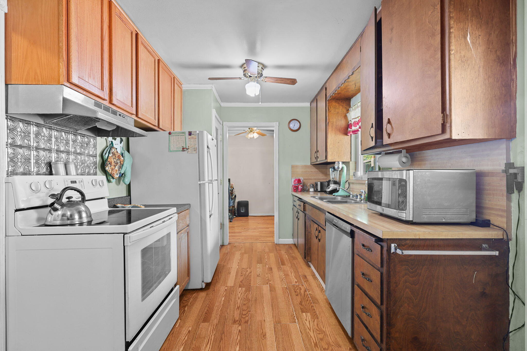 2165 Paris Avenue Redding, CA 96001 - Photo 2 of 22 a kitchen with stainless steel appliances granite countertop a sink stove and cabinets
