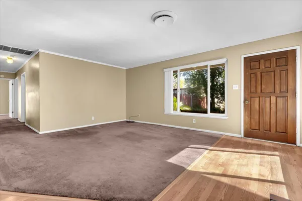 a view of an empty room with a window