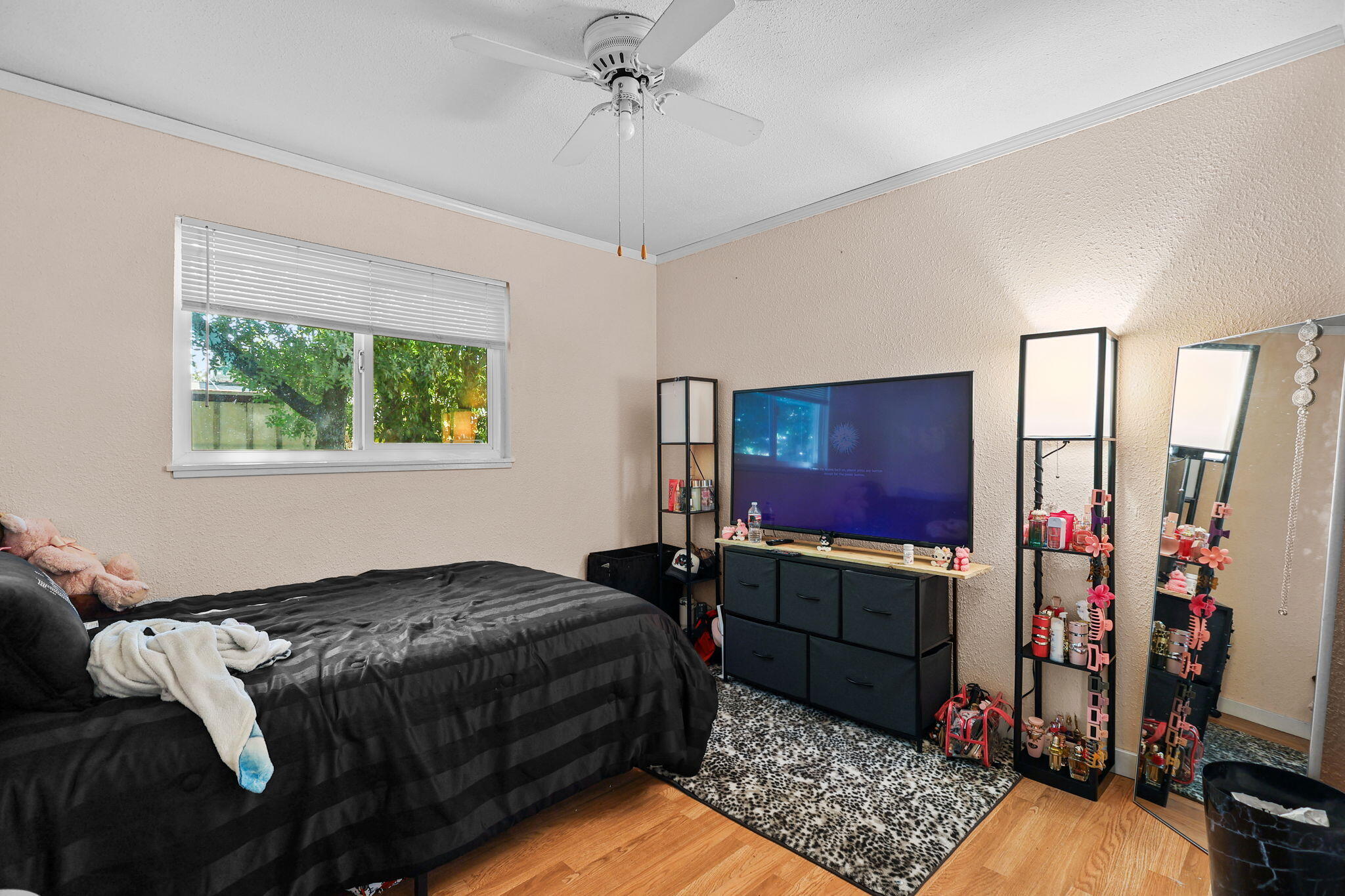 2165 Paris Avenue Redding, CA 96001 - Photo 9 of 22 a bedroom with a bed closet and a window