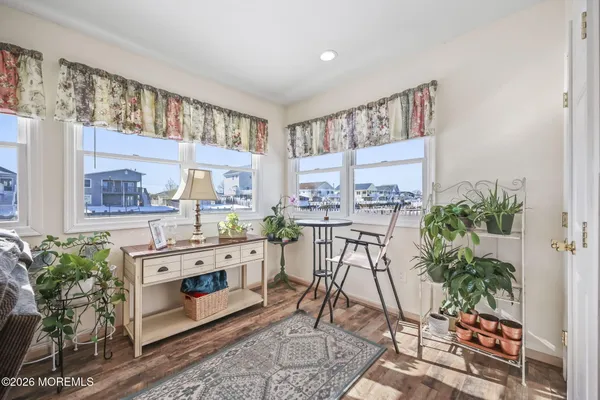 a view of a kitchen with furniture and a potted plant