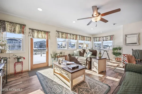 a living room with furniture a rug and a chandelier