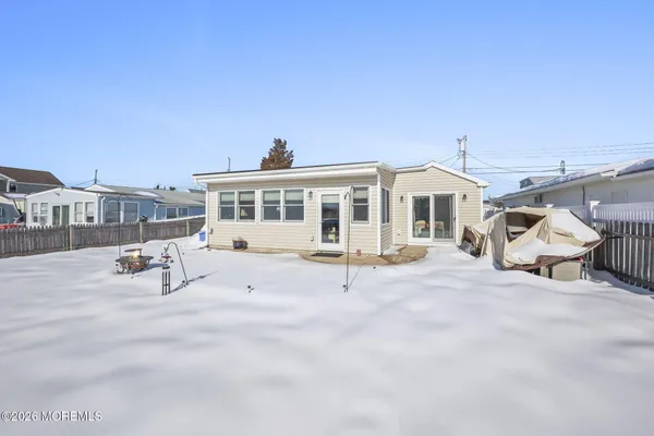 a view of a house with a swimming pool and yard