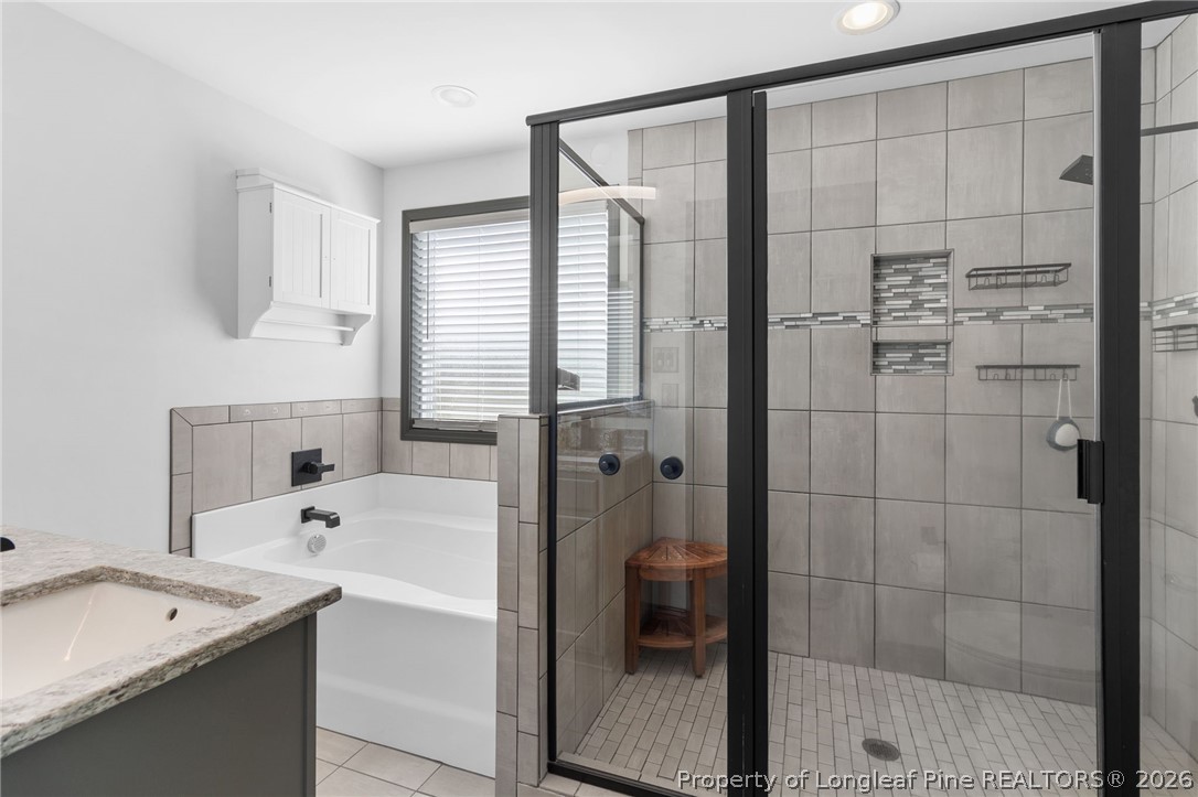 5535 Butler Nursery Road Fayetteville, NC 28306 - Photo 27 of 50 a bathroom with a bathtub and a shower