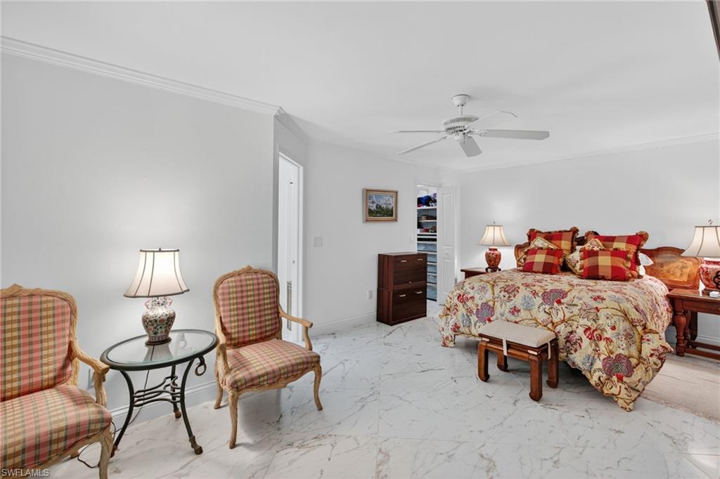 1741 17th Street Southwest Naples, FL 34117 - Photo 24 of 50 Bedroom with light satin finish porcelain tile flooring, ornamental molding, and a ceiling fan