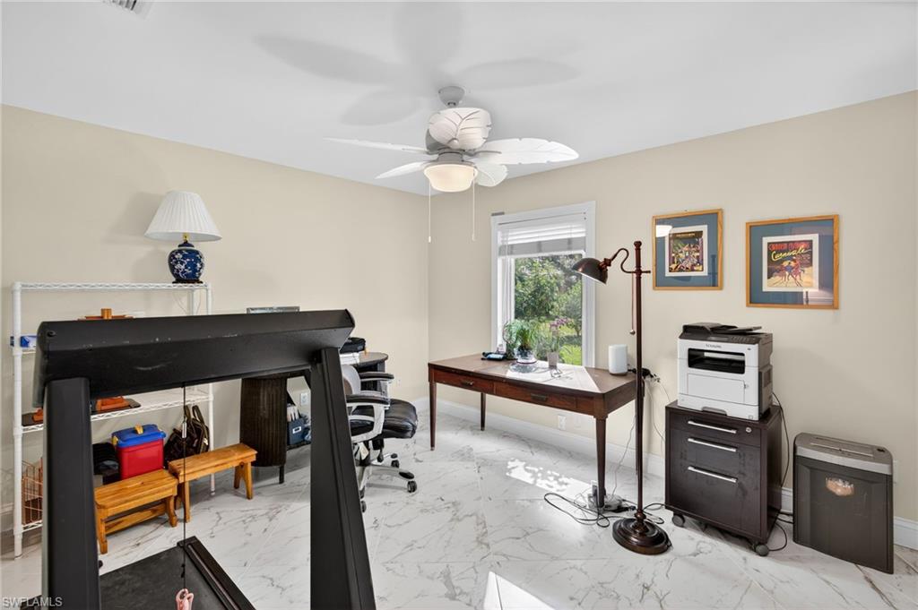 1741 17th Street Southwest Naples, FL 34117 - Photo 31 of 50 Office area featuring light satin finish porcelain tile flooring and a ceiling fan