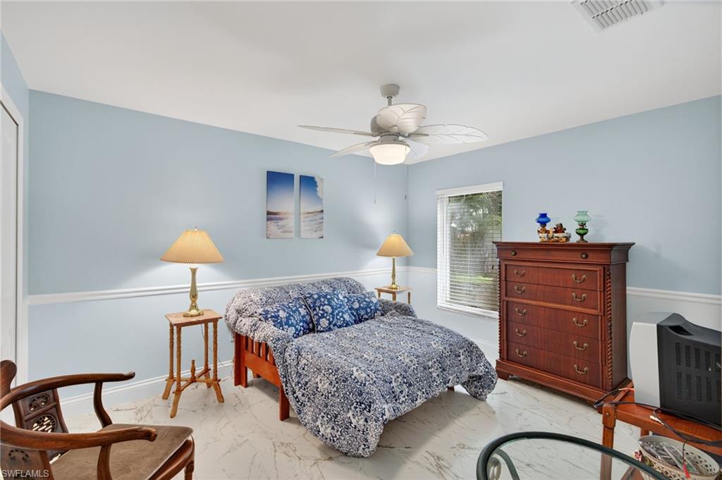 1741 17th Street Southwest Naples, FL 34117 - Photo 35 of 50 Bedroom featuring a ceiling fan and a closet