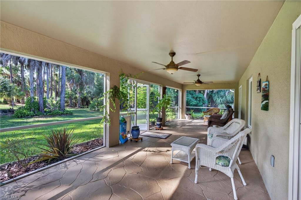 1741 17th Street Southwest Naples, FL 34117 - Photo 36 of 50 Sunroom featuring a ceiling fan and a patio area