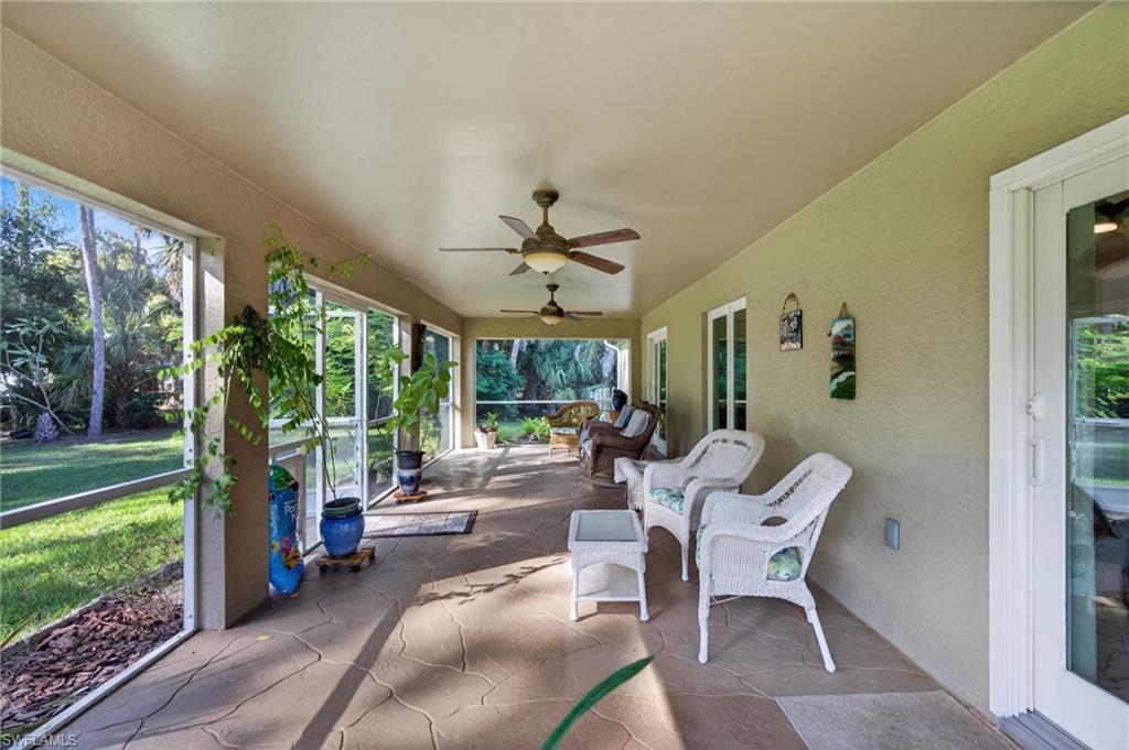 1741 17th Street Southwest Naples, FL 34117 - Photo 37 of 50 Sunroom / solarium featuring ceiling fan