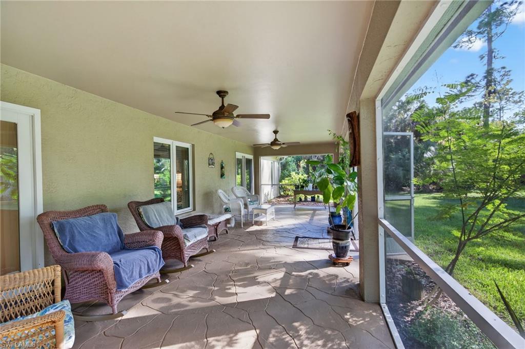 1741 17th Street Southwest Naples, FL 34117 - Photo 38 of 50 View of patio / terrace with a sunroom and a ceiling fan