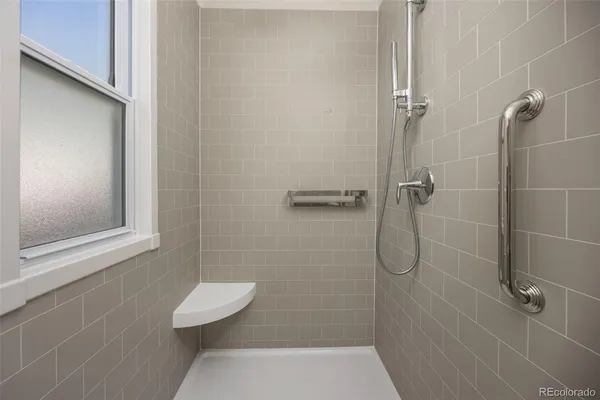 a bathroom with a shower and a toilet