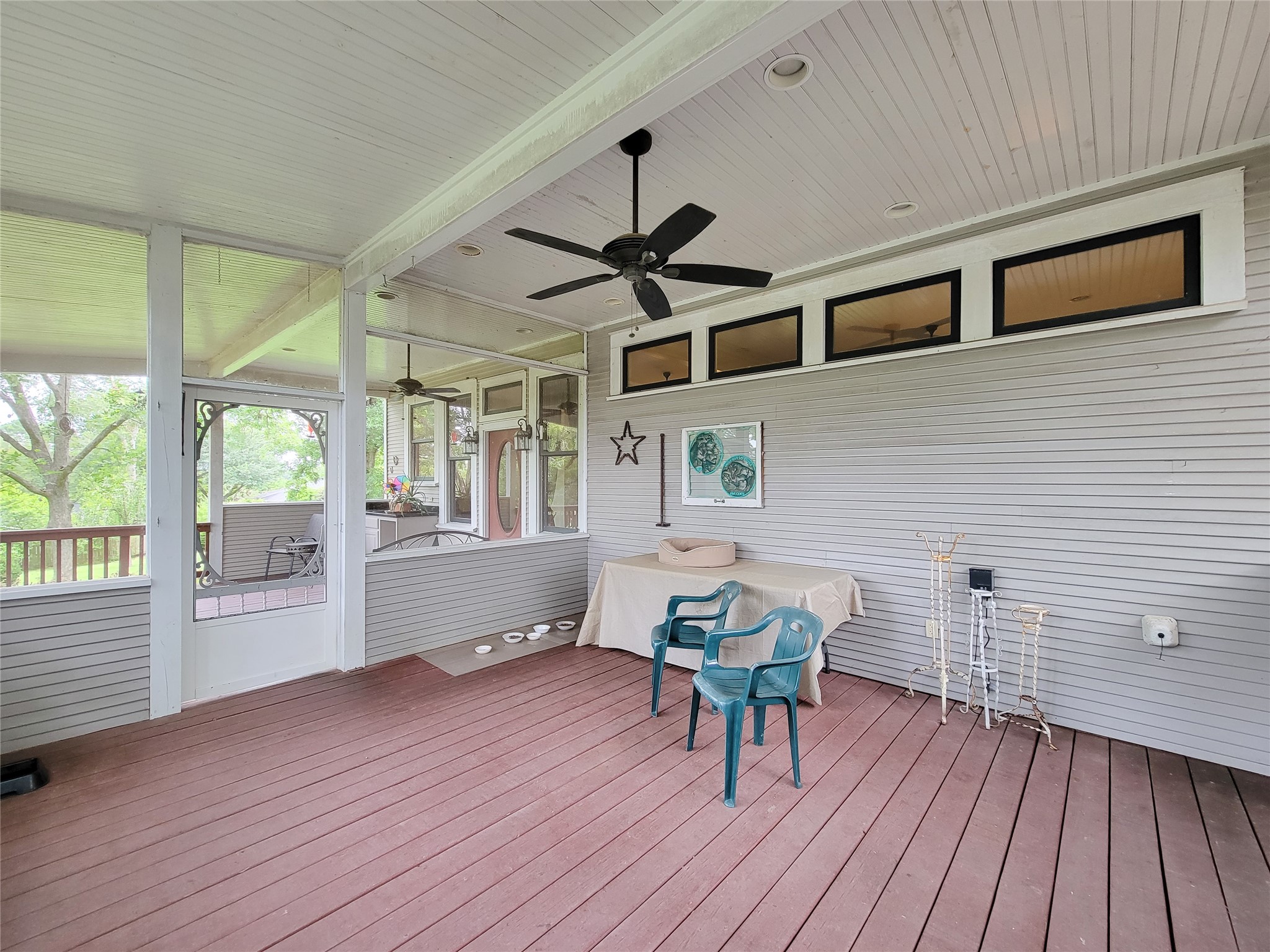1406 Key Street Brenham, TX 77833 - Photo 29 of 50 Enjoy serene outdoor living on the breezy screened porch, seamlessly connecting to a charming brick patio and greenhouse.