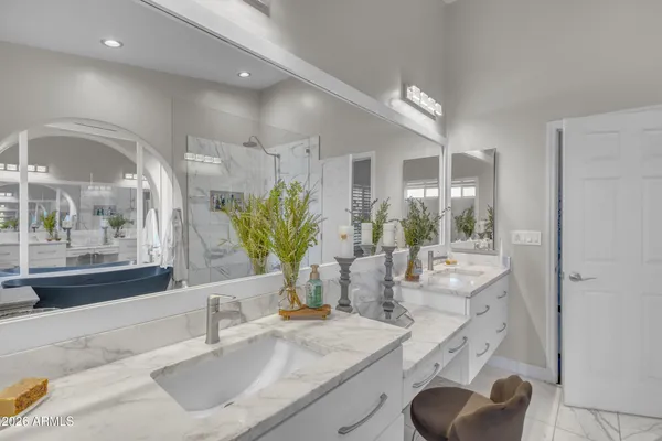 a bathroom with a granite countertop sink a toilet and a mirror