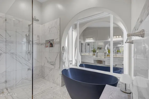 a bathroom with a bathtub and shower