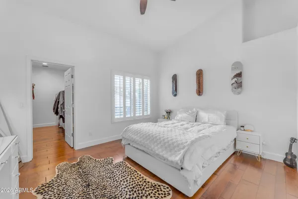 a bedroom with a bed and a couch