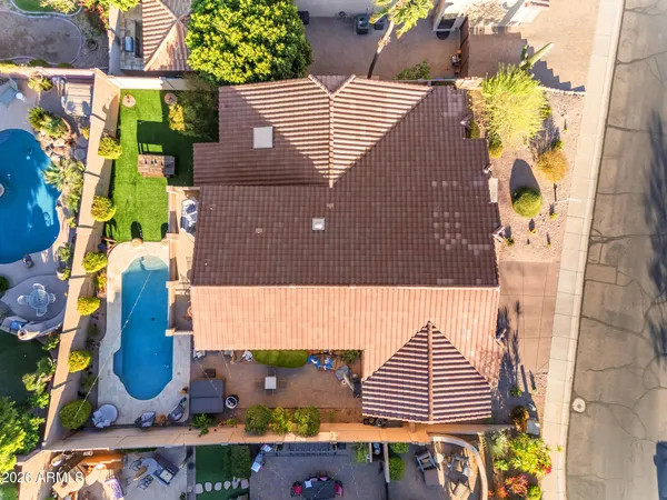 an aerial view of residential houses with outdoor space