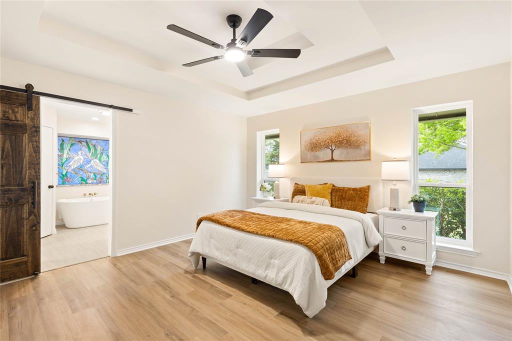 2850 Oak Tree Lane Midlothian, TX 76065 - Photo 15 of 40 a bedroom with a bed a wall painting and a window