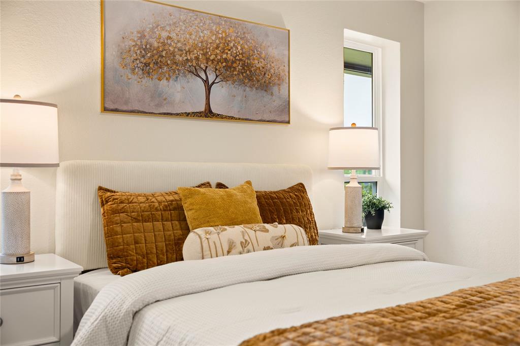 2850 Oak Tree Lane Midlothian, TX 76065 - Photo 17 of 40 a bedroom with a bed and painting on the wall