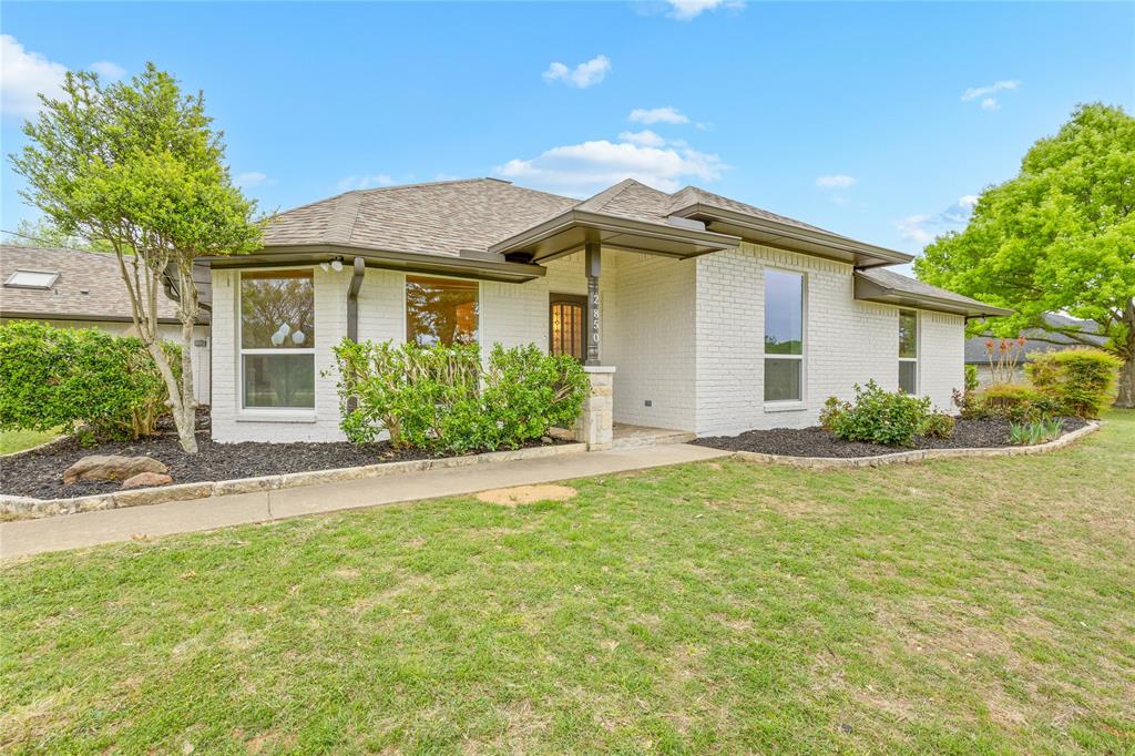 2850 Oak Tree Lane Midlothian, TX 76065 - Photo 2 of 40 a front view of a house with a garden
