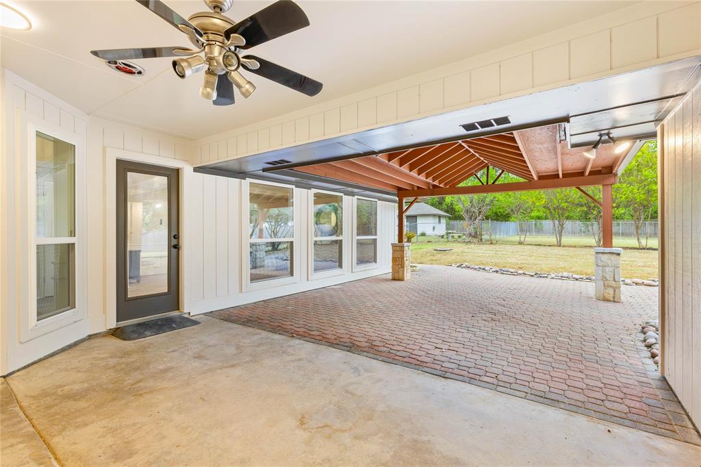 2850 Oak Tree Lane Midlothian, TX 76065 - Photo 32 of 40 a view of an empty room with a balcony and chandelier