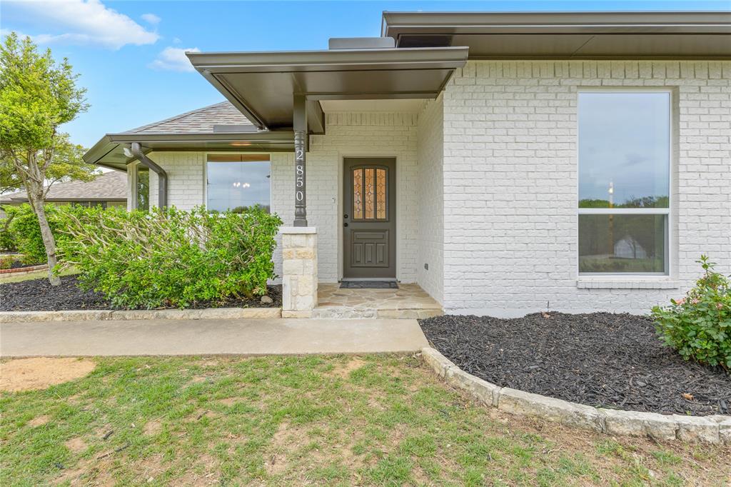 2850 Oak Tree Lane Midlothian, TX 76065 - Photo 40 of 40 a front view of a house with garden