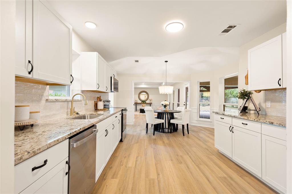 2850 Oak Tree Lane Midlothian, TX 76065 - Photo 5 of 40 a large kitchen with granite countertop lots of counter space and sink