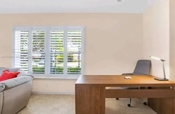 a living room with a couch and a window