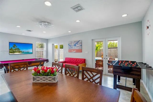 a living room with furniture and a rug