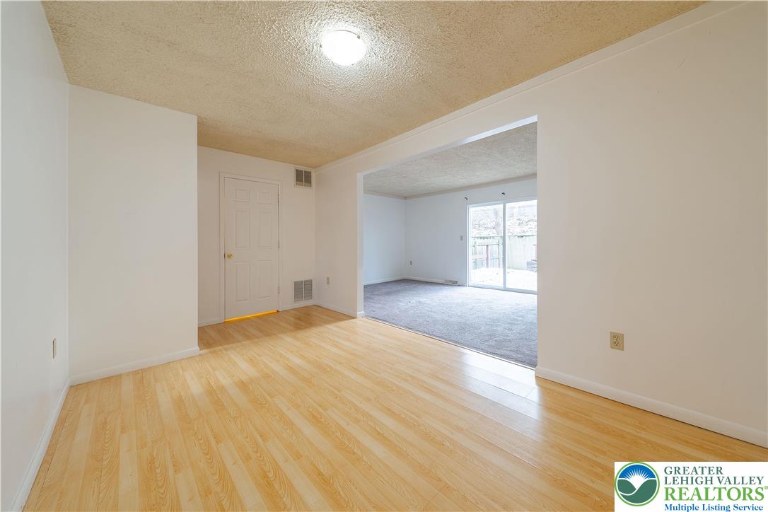 7528 Buttercup Road Lower Macungie Township, PA 18062 - Photo 11 of 30 a view of empty room with wooden floor