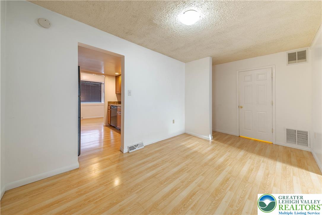 7528 Buttercup Road Lower Macungie Township, PA 18062 - Photo 12 of 30 a view of an empty room and wooden floor
