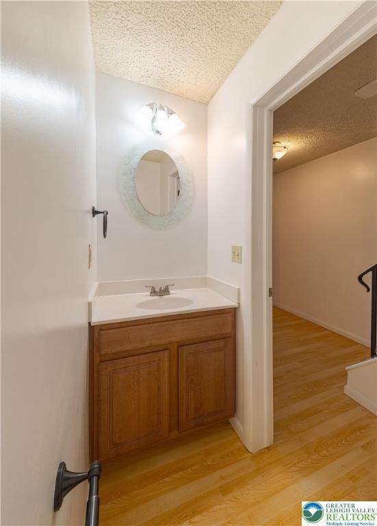 7528 Buttercup Road Lower Macungie Township, PA 18062 - Photo 16 of 30 a bathroom with a sink and a mirror