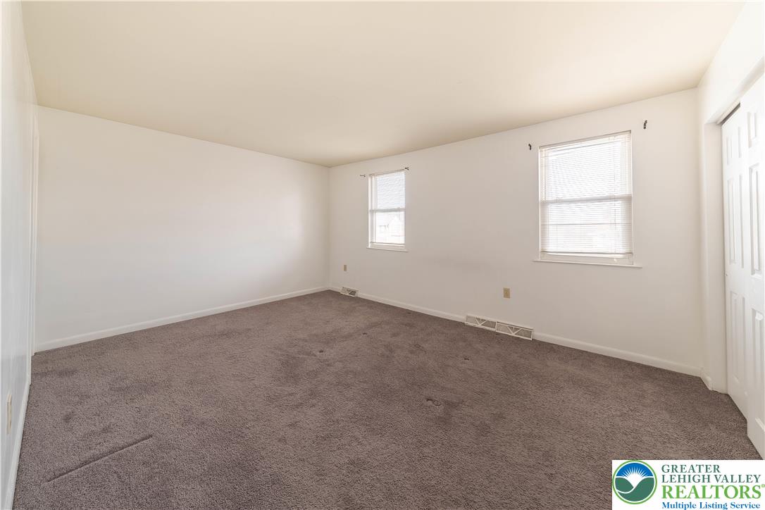 7528 Buttercup Road Lower Macungie Township, PA 18062 - Photo 18 of 30 an empty room with windows