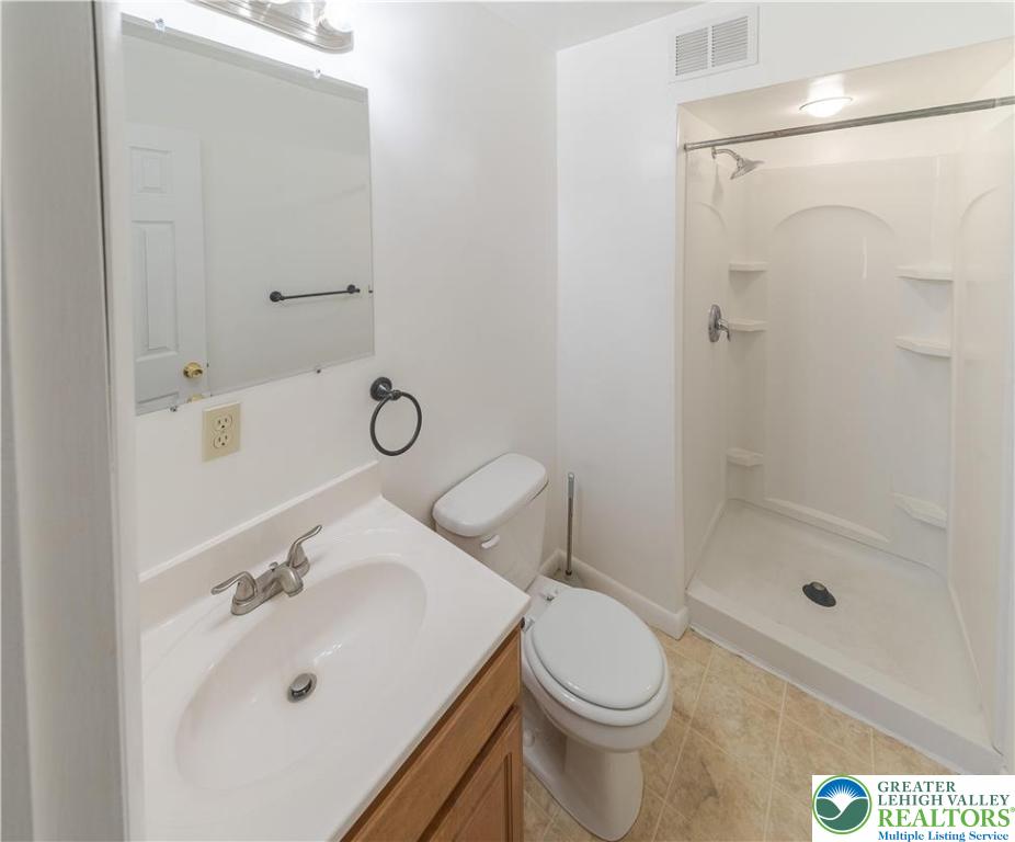 7528 Buttercup Road Lower Macungie Township, PA 18062 - Photo 20 of 30 a bathroom with a sink toilet and shower