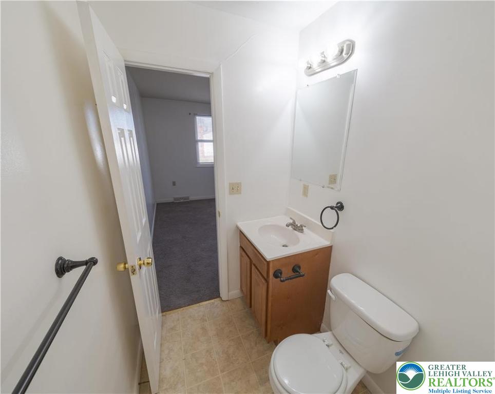 7528 Buttercup Road Lower Macungie Township, PA 18062 - Photo 21 of 30 a bathroom with a toilet sink and mirror