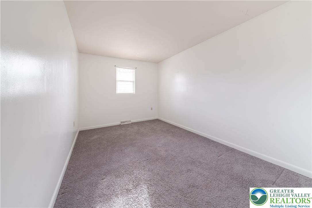 7528 Buttercup Road Lower Macungie Township, PA 18062 - Photo 25 of 30 an empty room with a window