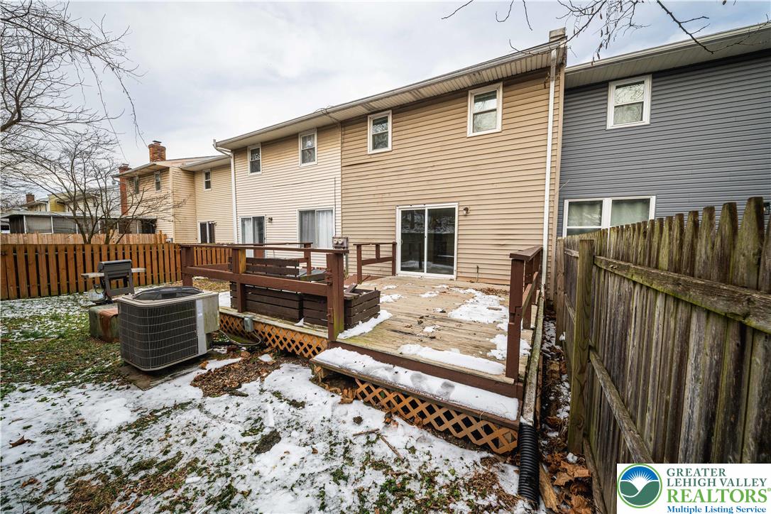 7528 Buttercup Road Lower Macungie Township, PA 18062 - Photo 28 of 30 a view of a patio with couches chairs potted plants and wooden floor