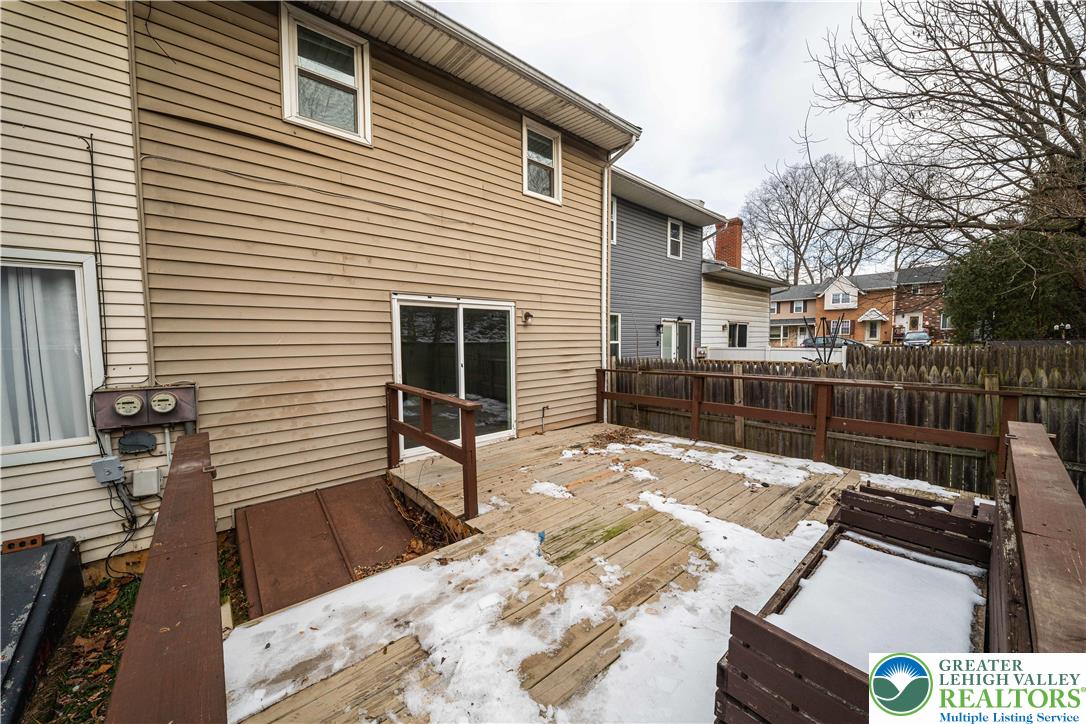 7528 Buttercup Road Lower Macungie Township, PA 18062 - Photo 30 of 30 a view of a patio with a table and chairs