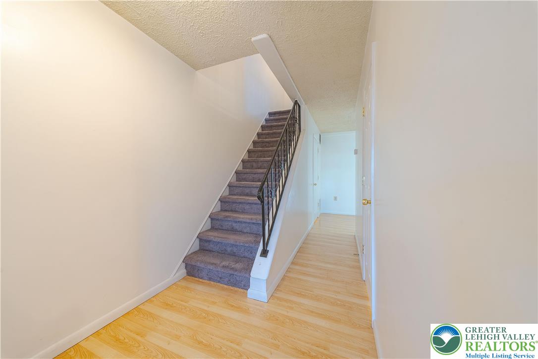 7528 Buttercup Road Lower Macungie Township, PA 18062 - Photo 5 of 30 a view of a hallway with wooden floor and entryway
