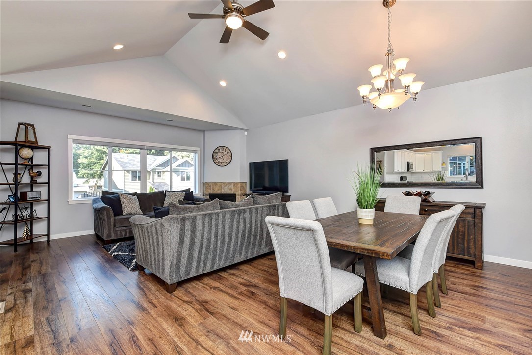 214 159th Street Southeast Bothell, WA 98012 - Photo 7 of 26 a view of a dining room with furniture window and wooden floor