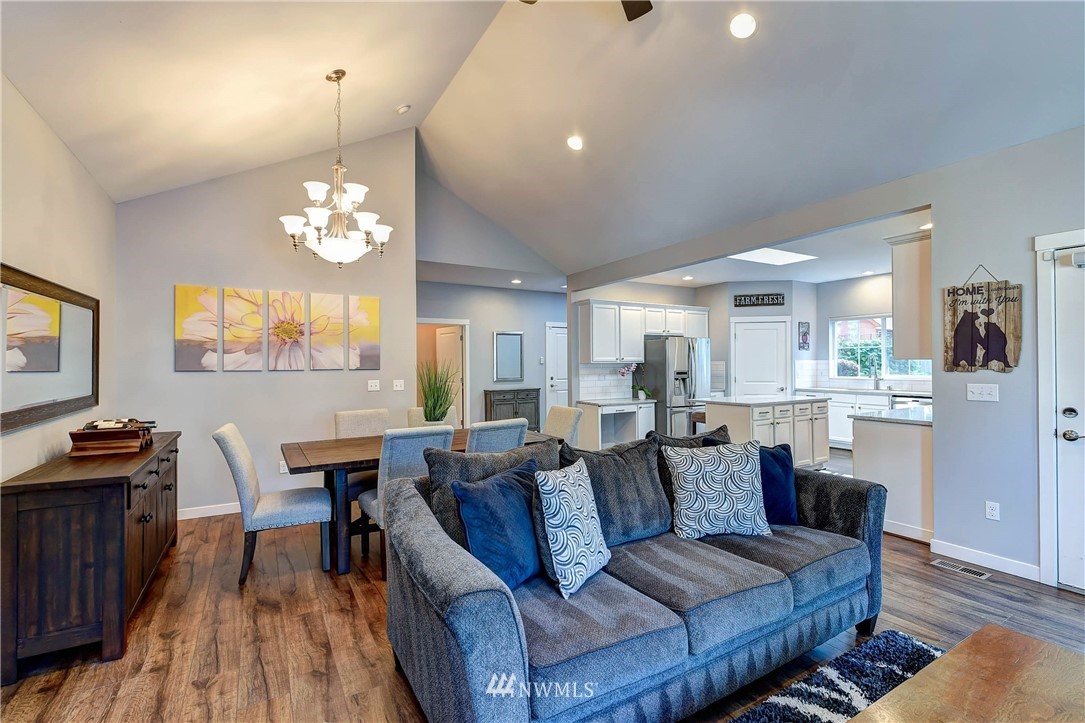 214 159th Street Southeast Bothell, WA 98012 - Photo 8 of 26 a living room with lots of furniture and a chandelier