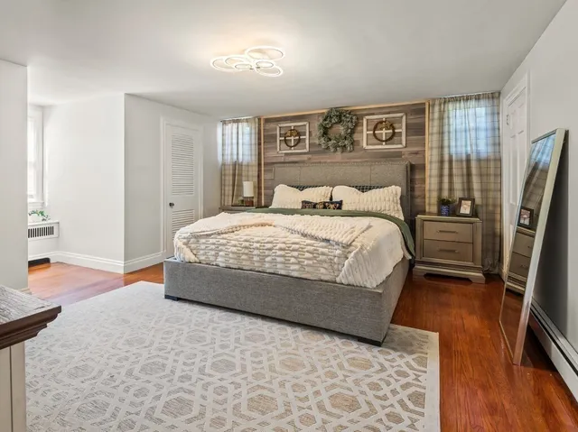 a bedroom with a bed and a television in it