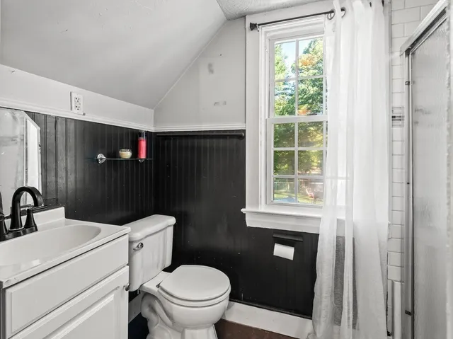 a view of a livingroom with furniture and a lounge chair